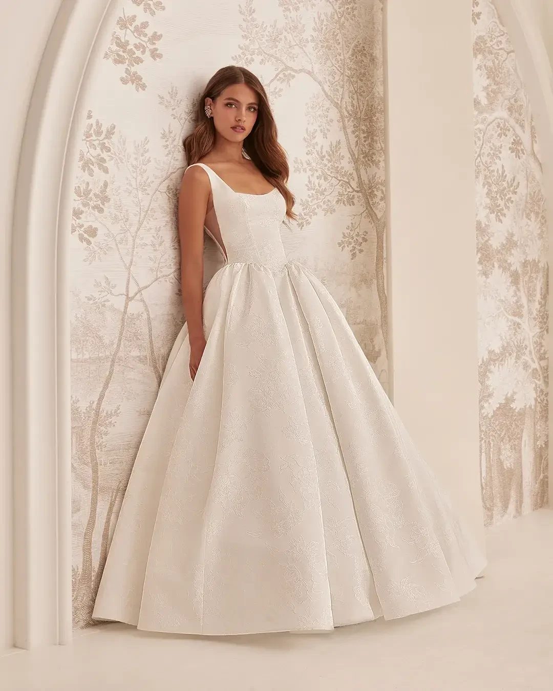 Model wearing a Mikaella gown