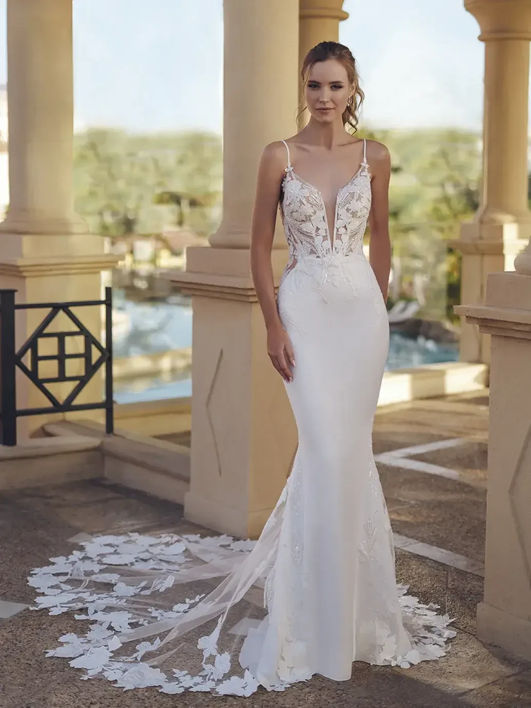 Model wearing a Blue By Enzoani gown