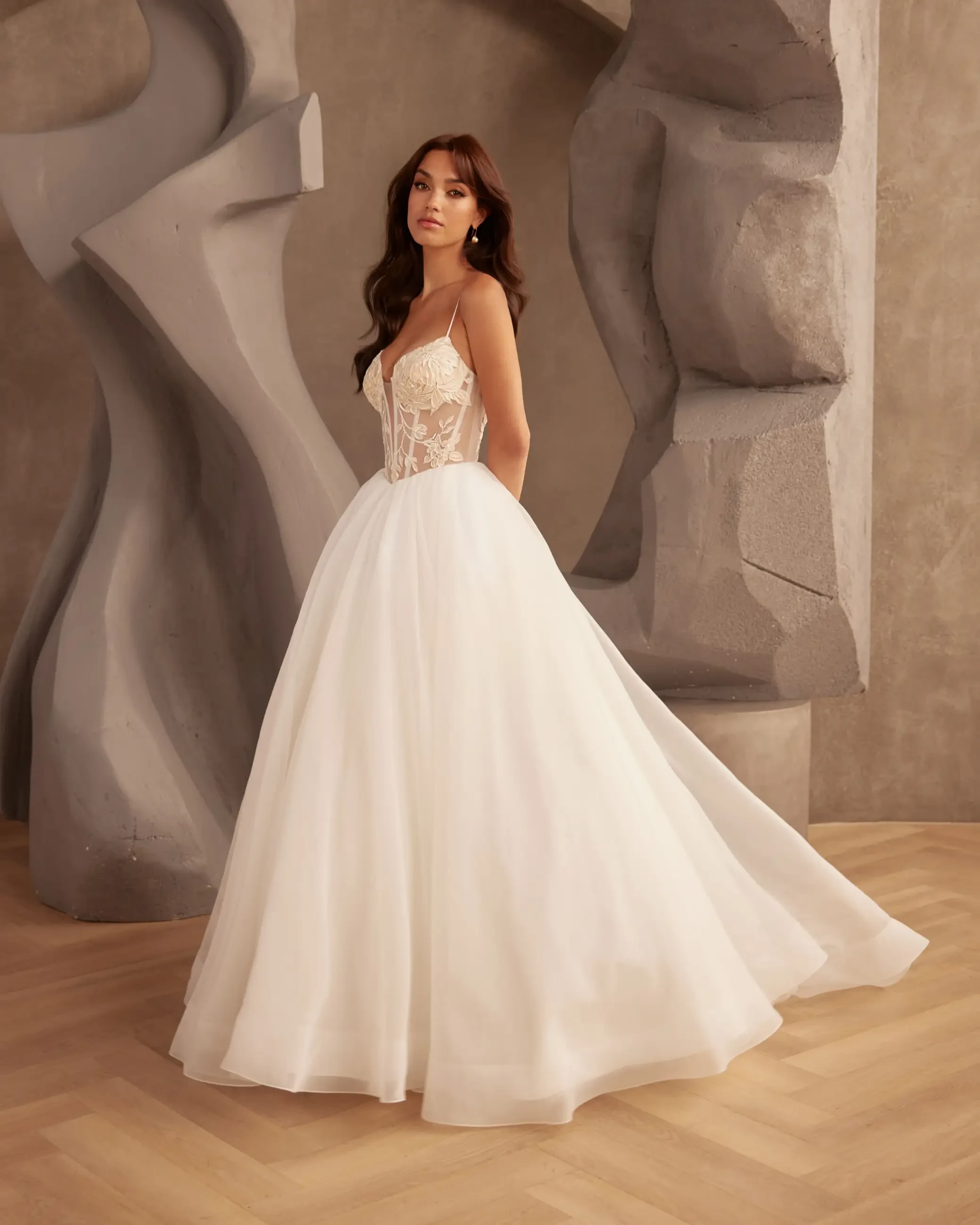 Model wearing a Paloma Blanca gown