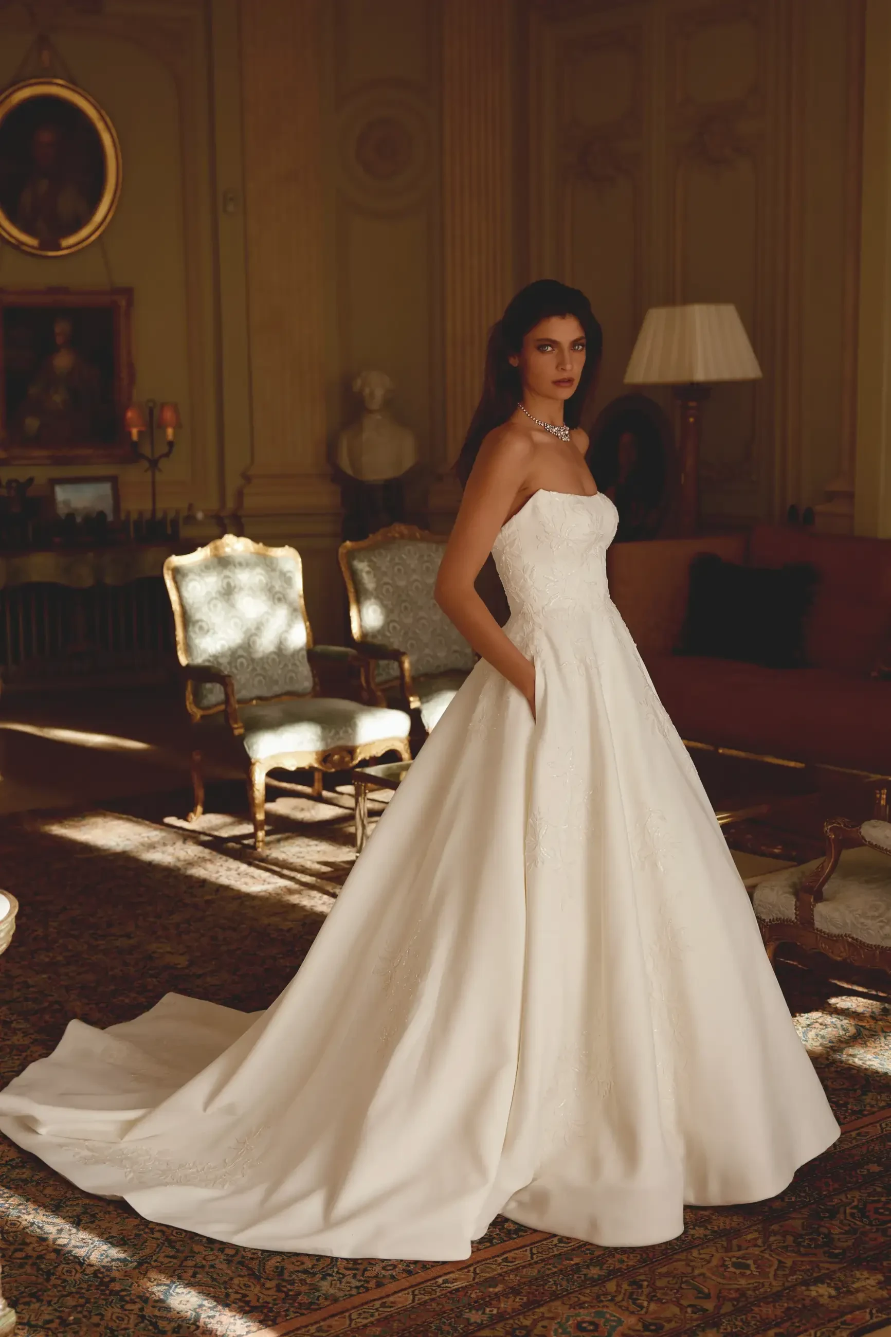 Model wearing a Justin Alexander gown